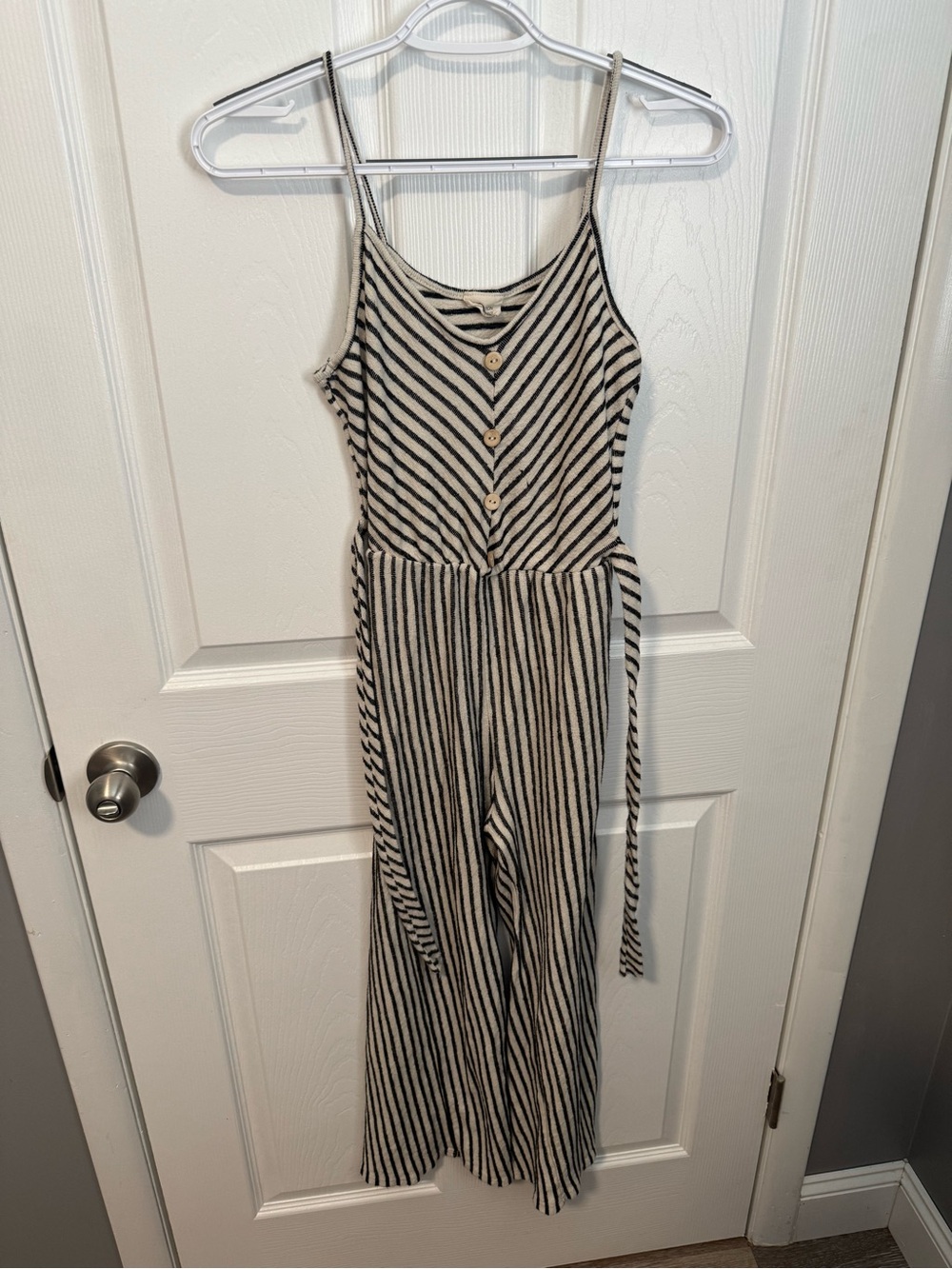 Striped Black and Cream Sleeveless Wide-Leg Jumpsuit with Waist Tie